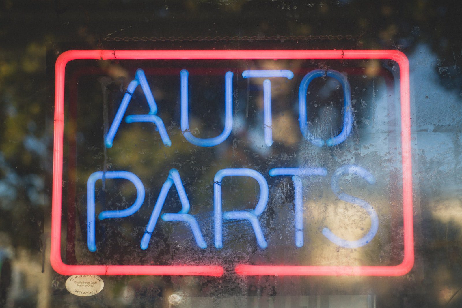 blue and red advance auto parts neon light signage